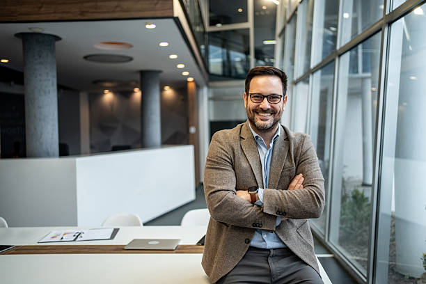 istock Businessman smiling confidently in modern office workplace 2256097638