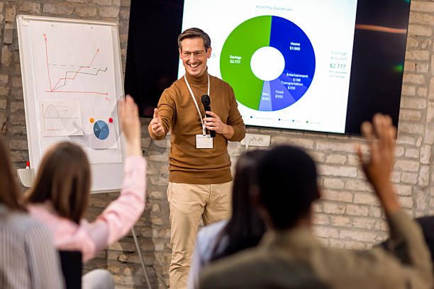 istock Business people Raising Hands During Conference 2256097899