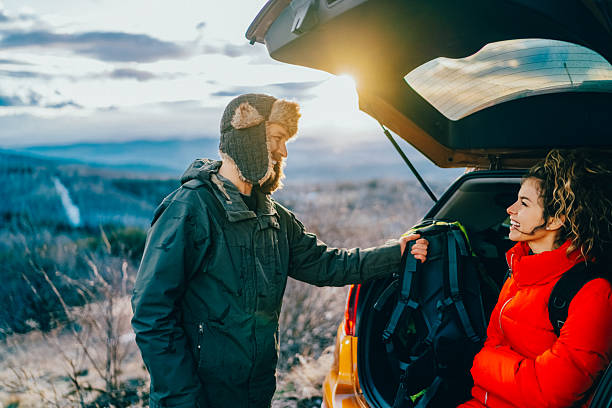 istock Couple Preparing for a Winter Mountain Hike During Road Trip 2256101091