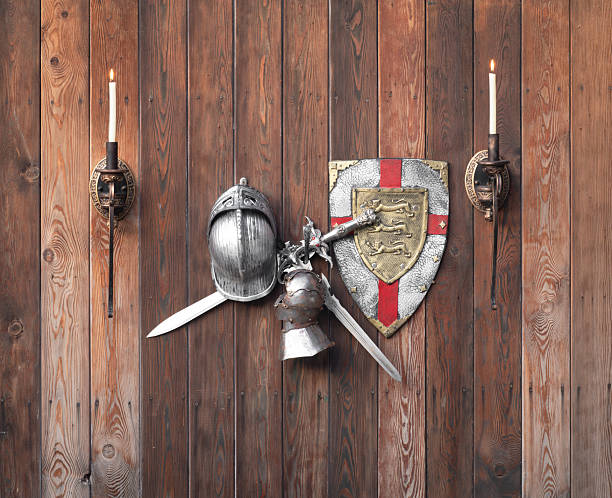 sword and round shield decorated with iron cross isolated on white