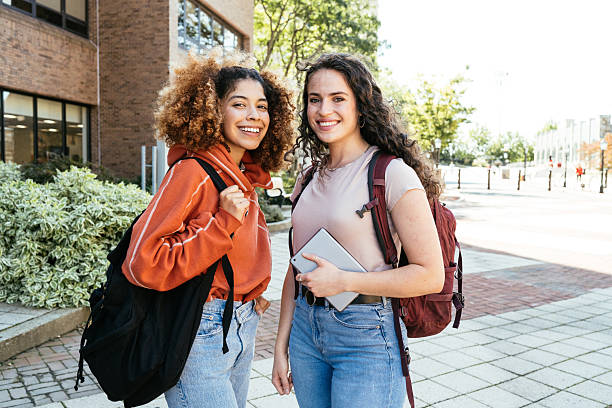 istock two adult post graduate students in campus, together looking at camera and expressing positivity 2256108341