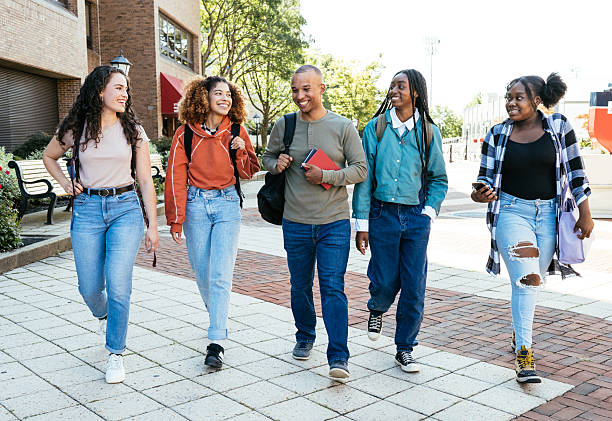 istock Group of diverse students in campus wearing casual clothes and going to classes together 2256108403