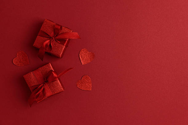 istock Red Glitter Gift Boxes and Hearts on Festive Background for Valentine's Day Celebration 2256112744