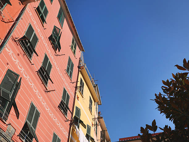 fragment of buildings with colorful facades and umbrellas, Italian seaside town of Vernazza, Italy