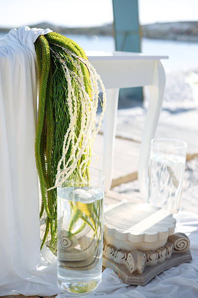 Romantic wedding ceremony. Beautiful setting for outdoors wedding ceremony waiting for bride and groom and guests. Decoration