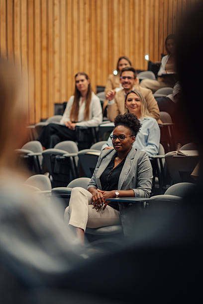 istock Business professionals attending a conference in an auditorium 2256125238