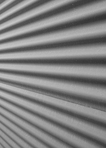 A corrugated metal wall texture with shadows and highlights adds a modern edge. Its versatile design suits various creative projects.