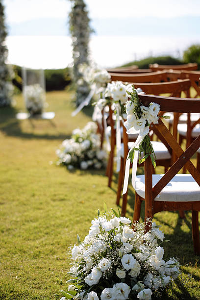 Shot of flowers on a chair before a wedding ceremony