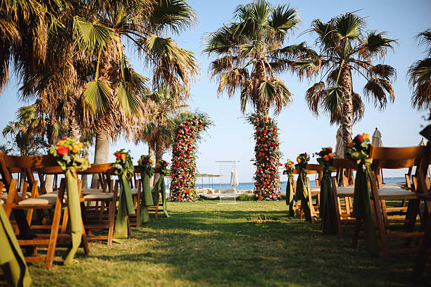 Romantic wedding ceremony. Beautiful setting for outdoors wedding ceremony waiting for bride and groom and guests. Decoration