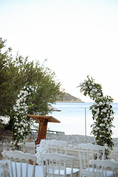 Romantic wedding ceremony. Beautiful setting for outdoors wedding ceremony waiting for bride and groom and guests. Decoration