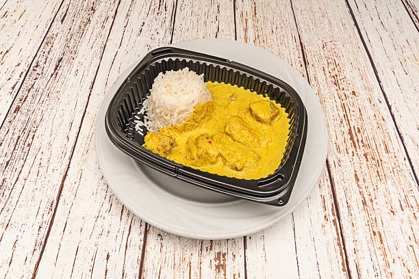 istock A serving of chicken curry with rice in a takeaway food container 2256129589