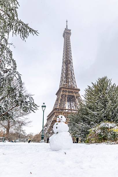 Paris, France - January 7, 2026: Scenic view to the Eiffel tower on a day with heavy snow. Unusual weather conditions in Paris