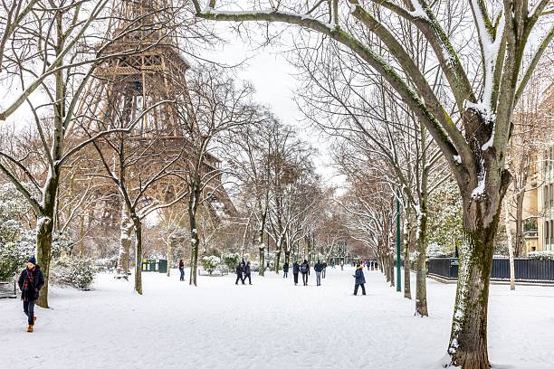 Paris, France - January 7, 2026: Scenic view to the Eiffel tower on a day with heavy snow. Unusual weather conditions in Paris