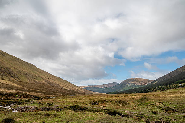 Big skies and panoramic vista across the mountain wilderness of Sutherland in north west Scotland, from the iconic ridge of Suilvan across the lochs of Inverpolly to Cul Mor.