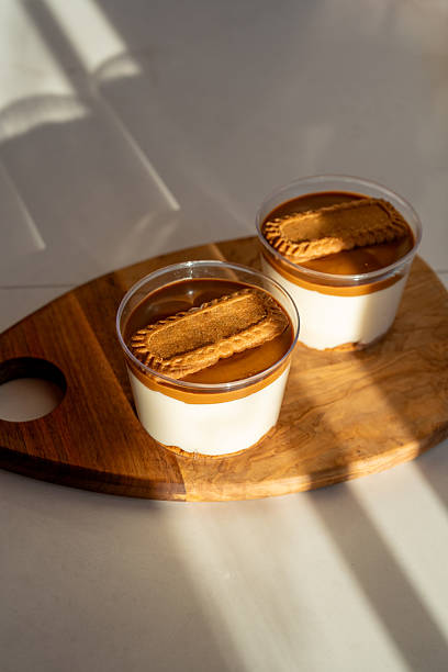 Magnolia Dessert with Caramel Biscuit Crumbs in Glass Cup