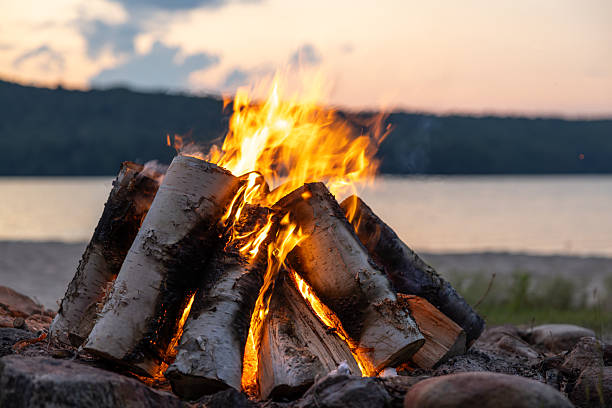 Summer Campfire and Lake at sunset filmed in super slow motion