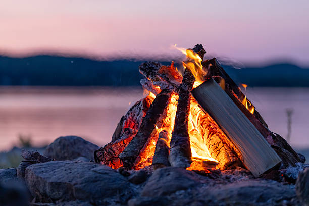 Summer Campfire and Lake at sunset filmed in super slow motion