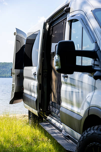 istock Van Life, Camper Van Parked Close to a Lake During Summer 2256146796