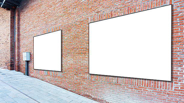 istock White advertising panels on a brick wall 2256147199