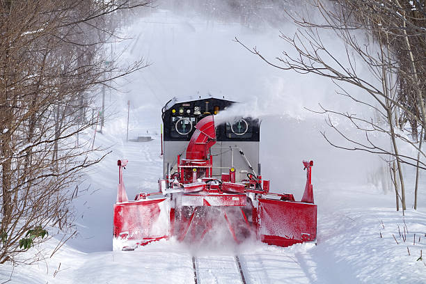 Nikii-cho, Hokkaido, Japan - January 12, 2026 : Snow removal train to fly snow runs on the Hakodate line