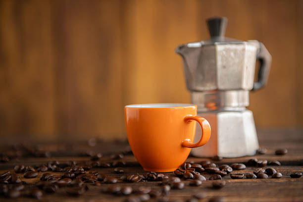 White cups of coffe on light background.