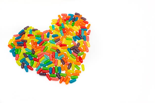 Small assorted candies forming a heart shape, symbolizing love and celebration