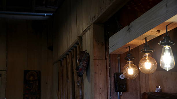 Old street lamp casts a warm glow in an old fashioned room, which is both solemn and warm.