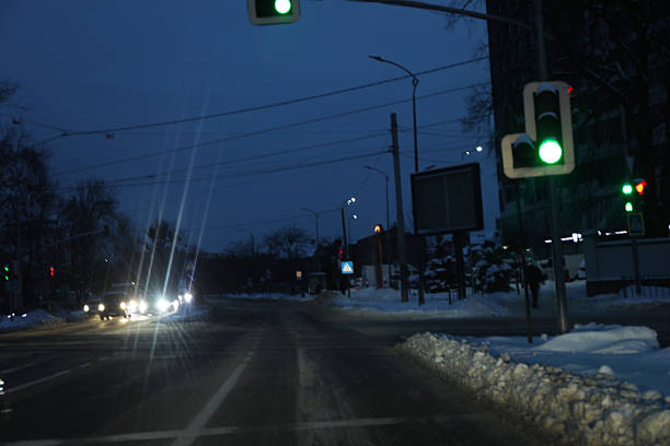 Road in a snowy city, road signs