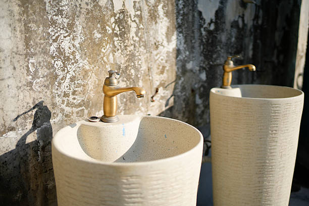 Most school sinks in Thailand are made of simple aluminum sets arranged in several places for children to stand in a row to wash their hands or face during breaks or after meals.
