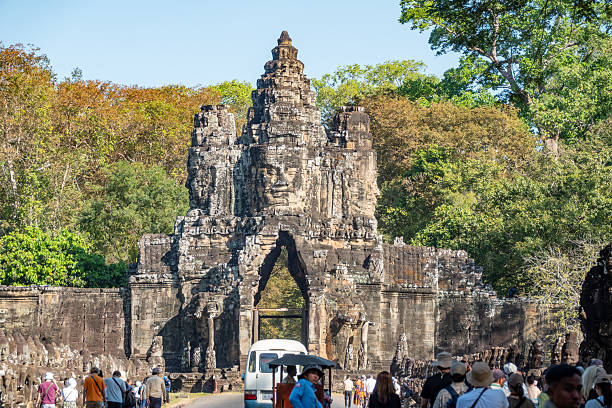 Tourists near South Gate at Angkor Thom in Siem Reap Province, Cambodia