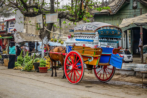 Mandalay, Myanmar - Feb 25, 2016. Traditional horse-drawn carriages on the streets of Mandalay, Myanmar.