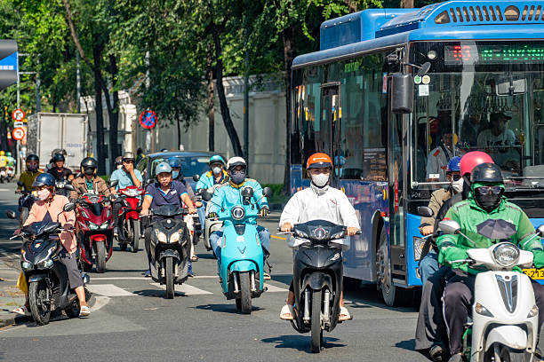 People riding on Scooters in Ho Chi Minh City, Vietnam