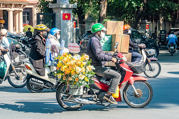 Mobile Florist in Hanoi, Vietnam, with many people visible.
