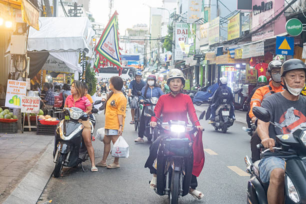 People riding on Scooters in Ho Chi Minh City, Vietnam