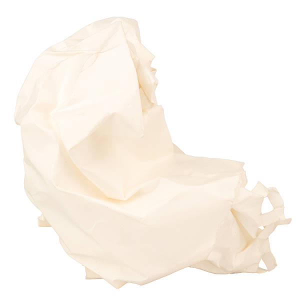 A heavily crumpled large sheet of paper as a background.