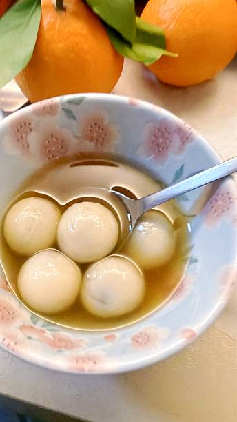 Glutinous Rice Balls with Black Sesame Filling in Ginger Soup