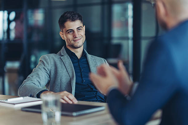 istock Confident young man attending a business meeting 2256212977