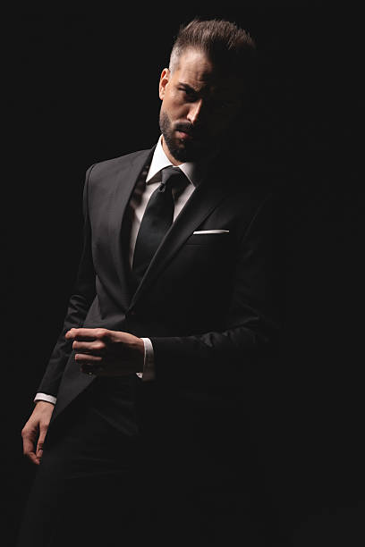 istock Serious man standing with hand in a fist 2256220531