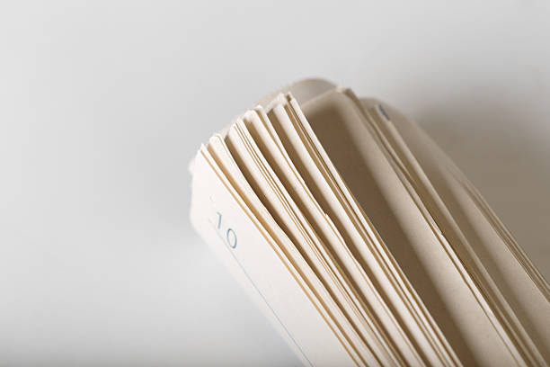Blank sheets are arranged neatly, revealing printed numbers along the edges in clear light.