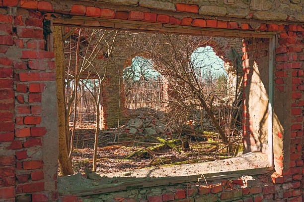 The ruins of an old brick house in the old winter park. Russia the first half of the 19th century, manor of the nobility, stable probably