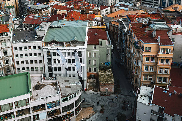 Istanbul, Turkey – November 27, 2013: Panoramic view of Istanbul city rooftops and waterfront under cloudy skies.