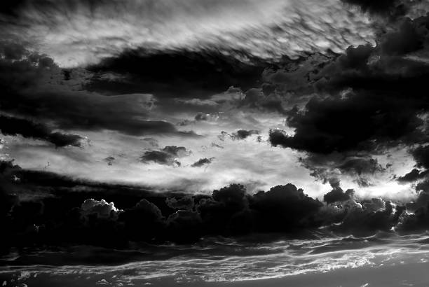 High contrast Dramatic dark sky and clouds copy space in black and white