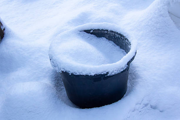 Large construction bucket filled with snow. Photo take in Carinthia, Austria on the 10th of January 2026.