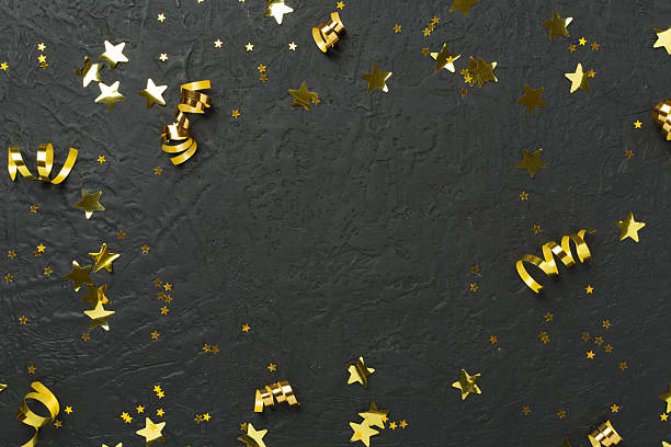 istock Golden gift boxes and confetti on concrete background, top view 2256235258