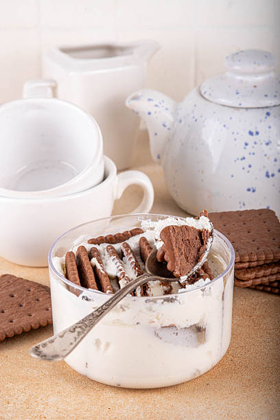 Simple two ingredient yogurt cheesecake in glass, viral tasty quick recipe made with greek yogurt and chocolate biscuits, copy space