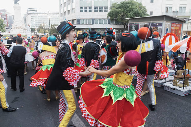 Lisbon, Portugal - June 12, 2023: A couple dressed in traditional folklore costumes dances while preparing to parade in Lisbon downtown during this city celebrations of the Popular Saints.