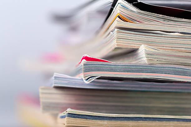 istock Stacks of magazines on a table in a bright room during the afternoon 2256237291
