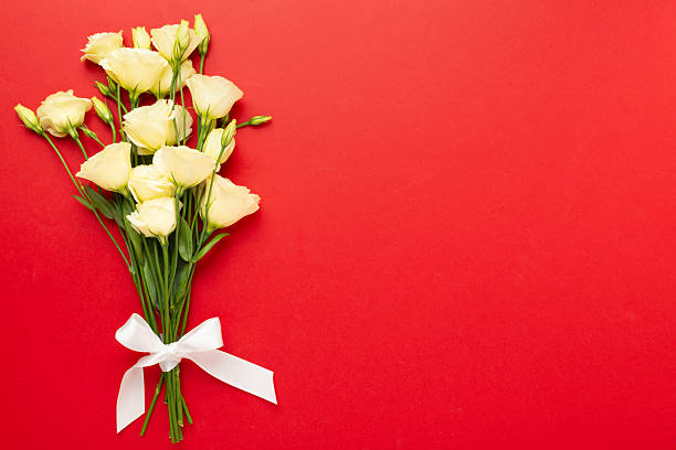 Nacre wave fabric silk with white rose flower bouquet. Abstract texture horizontal copy space background.
