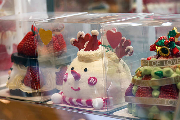 Small cakes are being sold in the shop window.