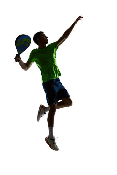istock Padel athlete airborne powerful smash silhouette 2256243748